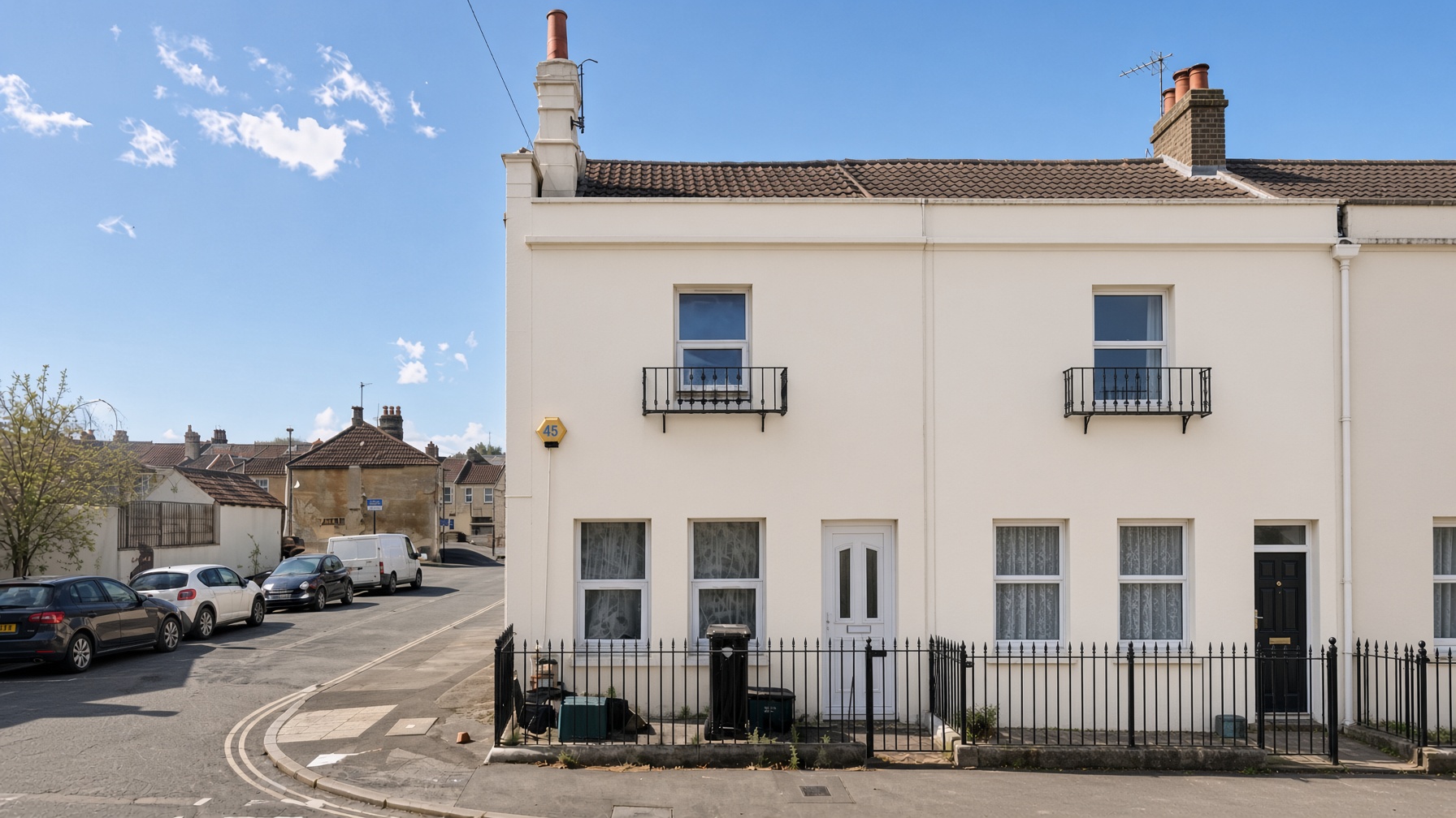 Front elevation of 14A Brougham Hayes on the corner with cream facade and Juliette balconies