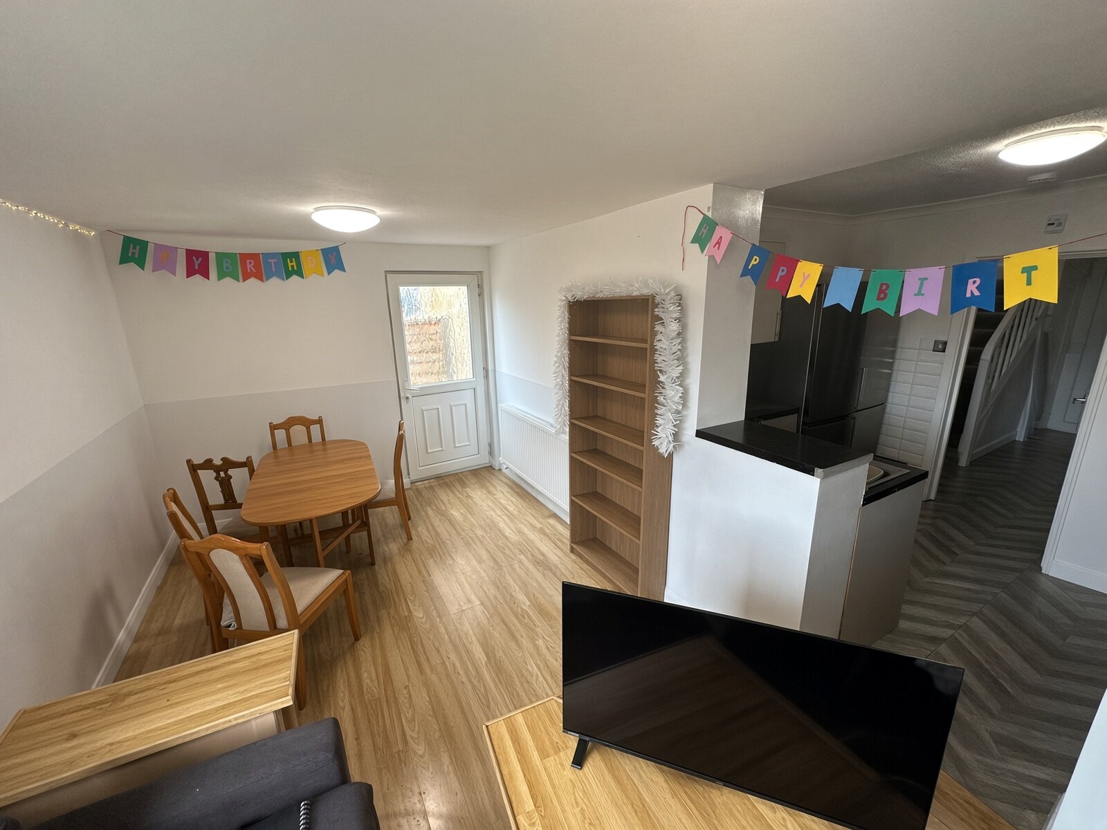 Dining area with table and chairs by the garden window