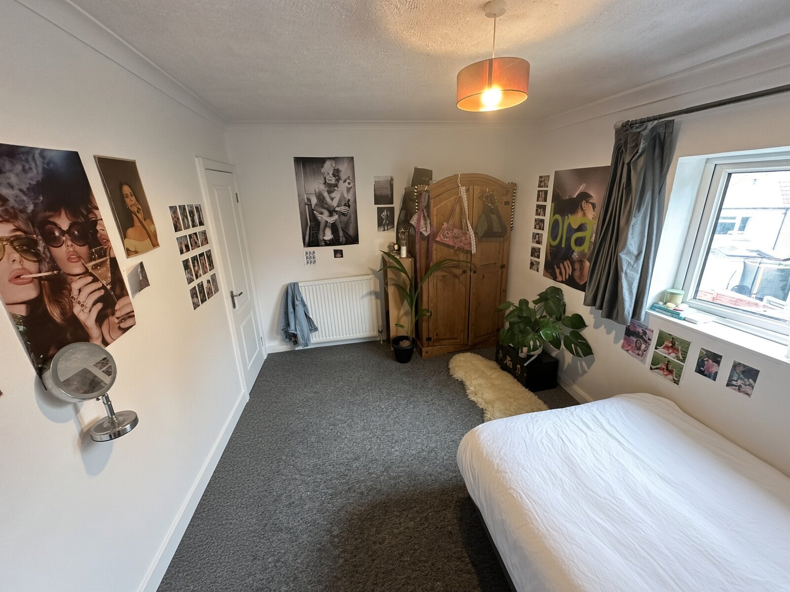 Bedroom with double bed, wardrobe and window