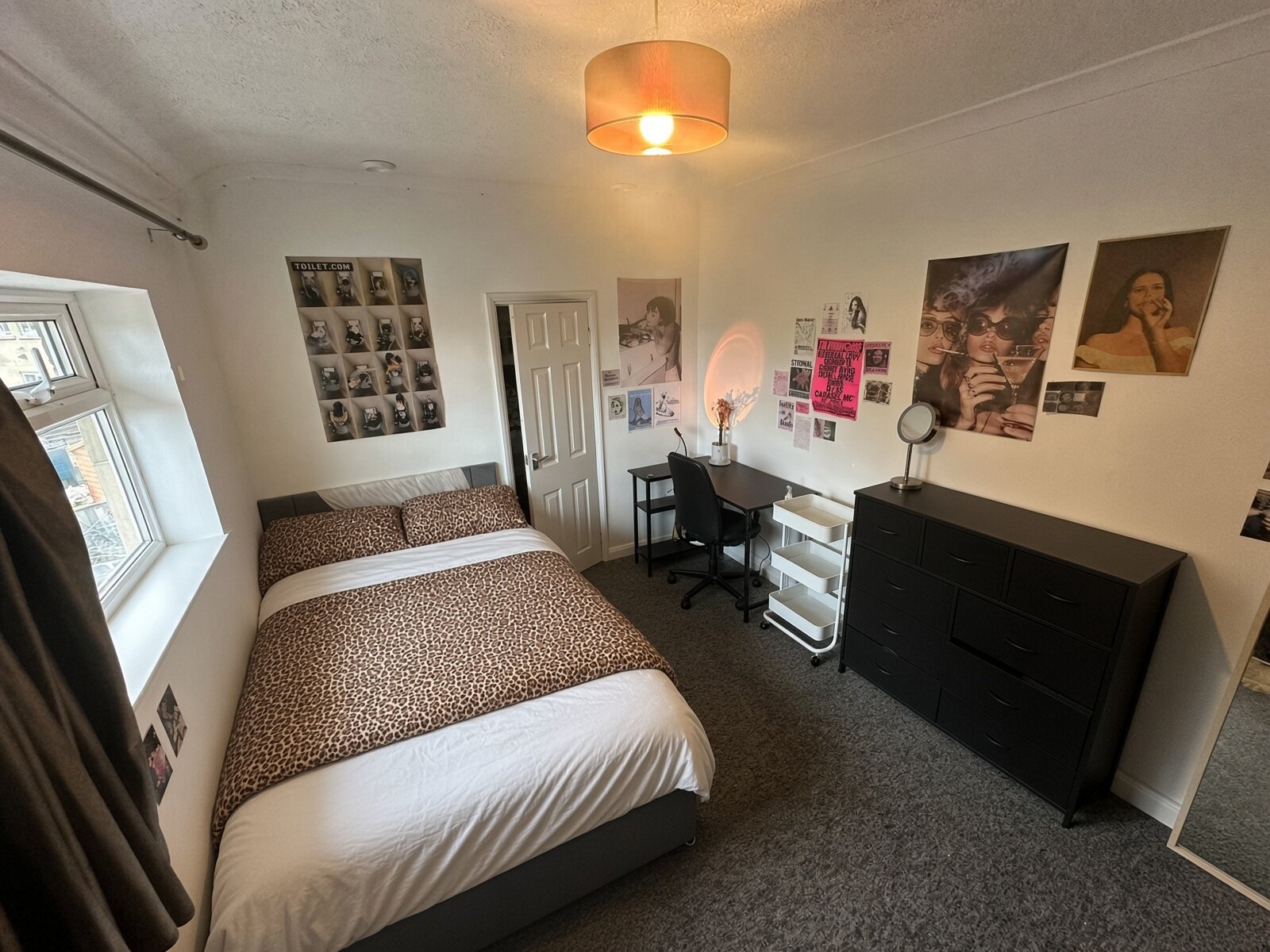 Bedroom with double bed, chest of drawers and pendant light