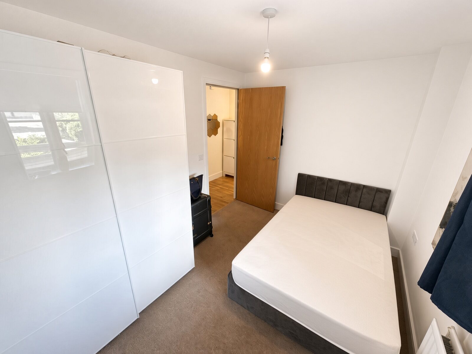 Bedroom with white wardrobe