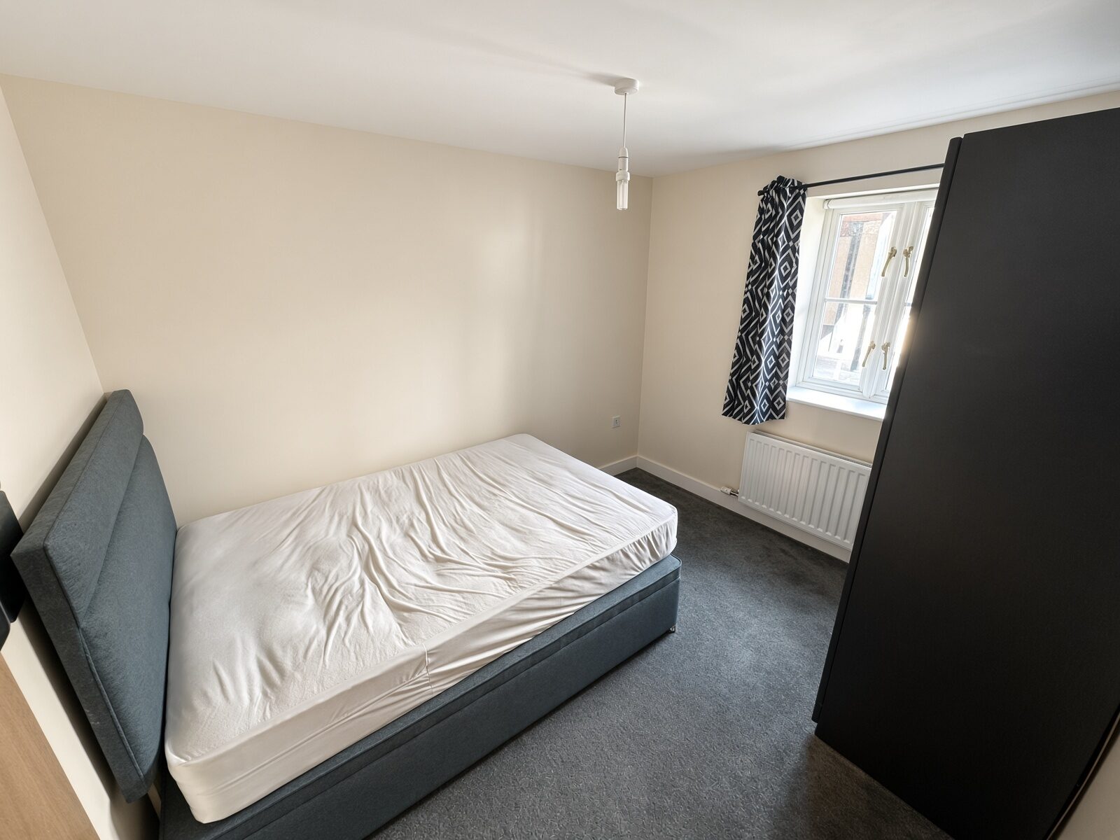 Bedroom with window and radiator