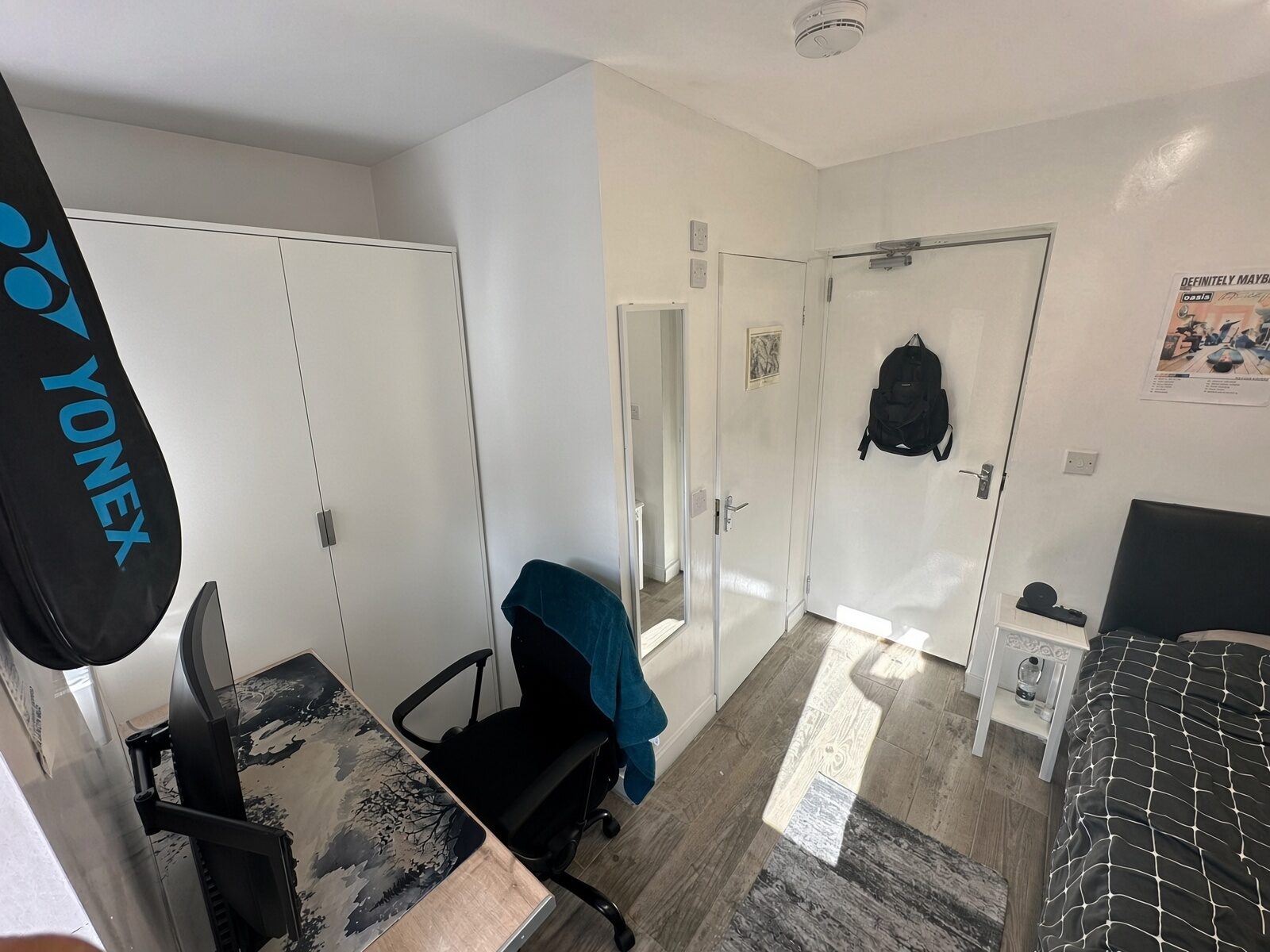 Bedroom with desk, chair and wardrobe