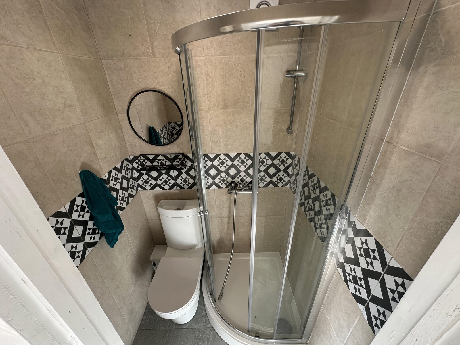 Shower room with corner shower, WC and basin
