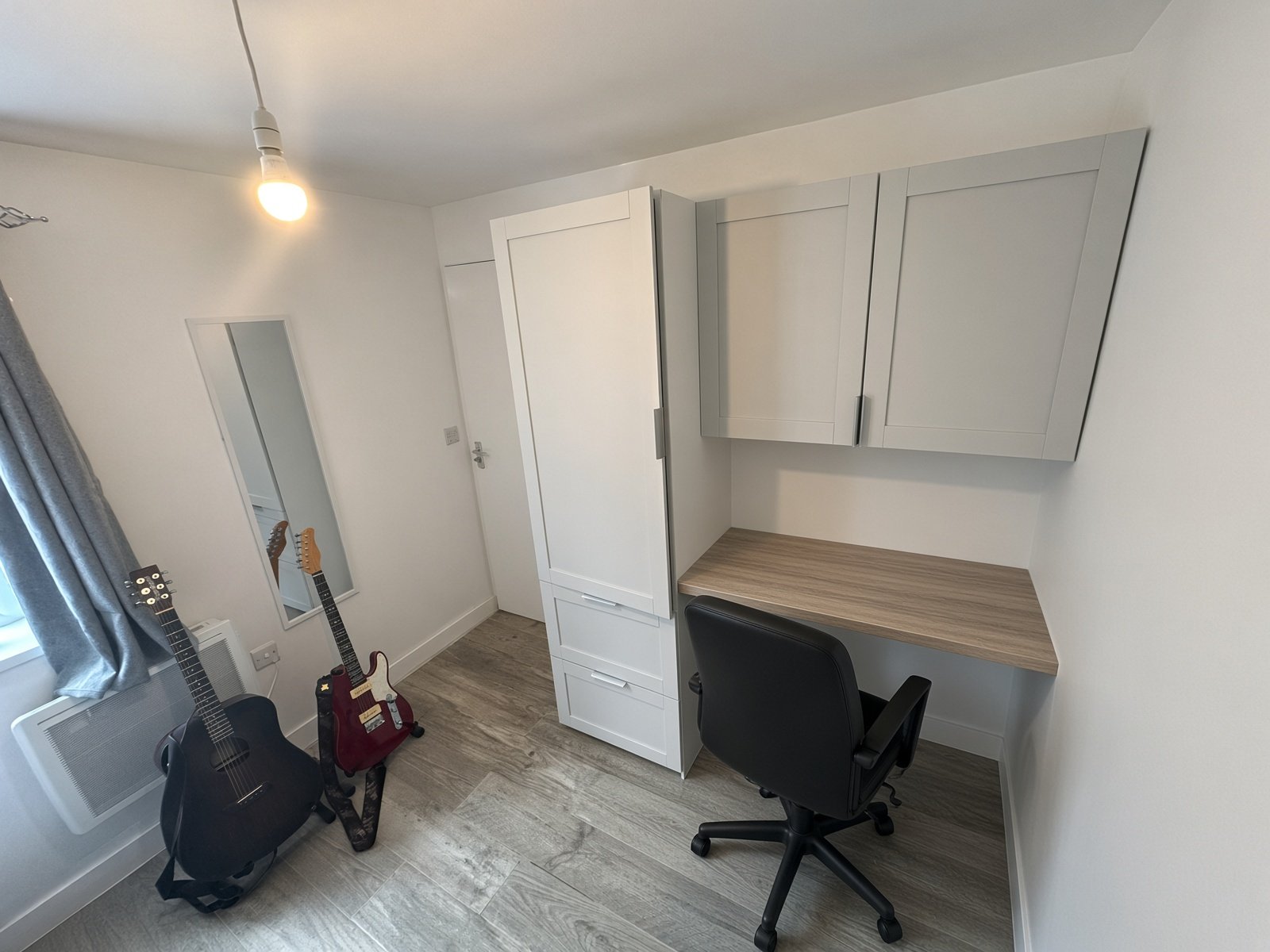 Bedroom study area with built-in desk and wardrobe
