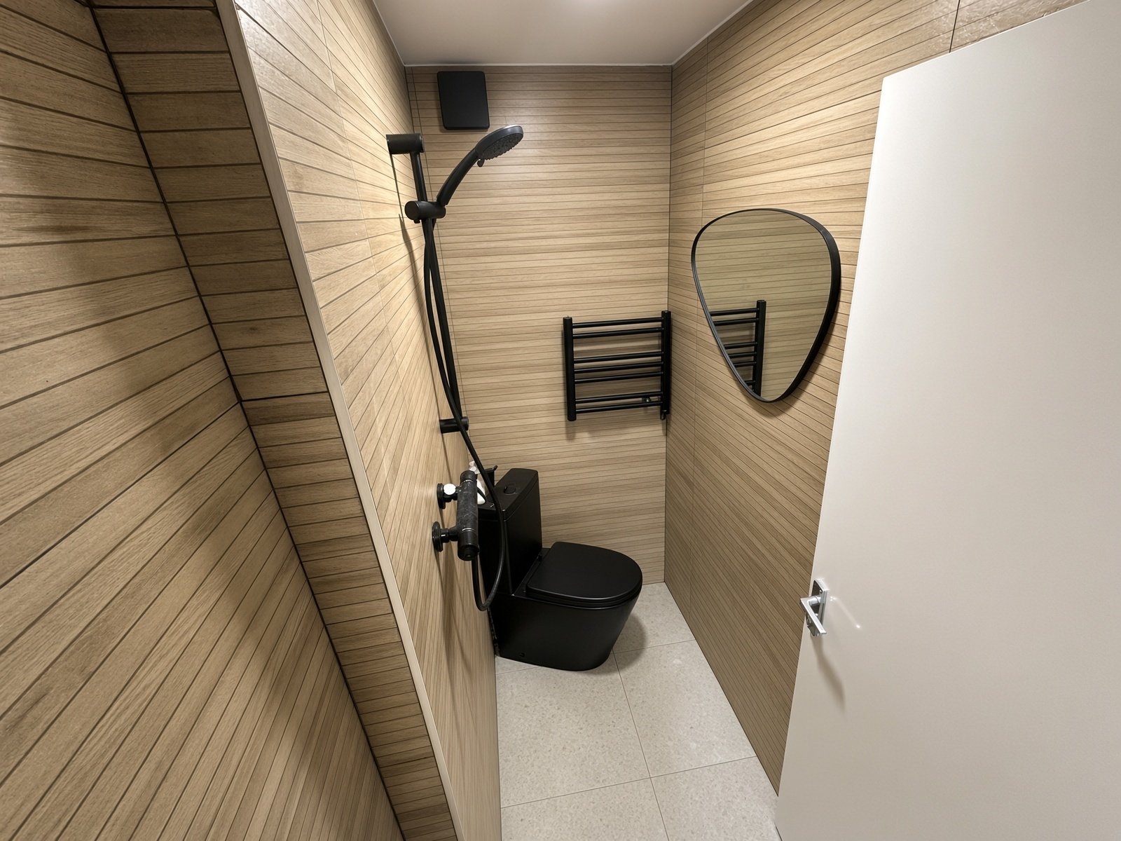 Shower room with wood-effect panelling and black WC