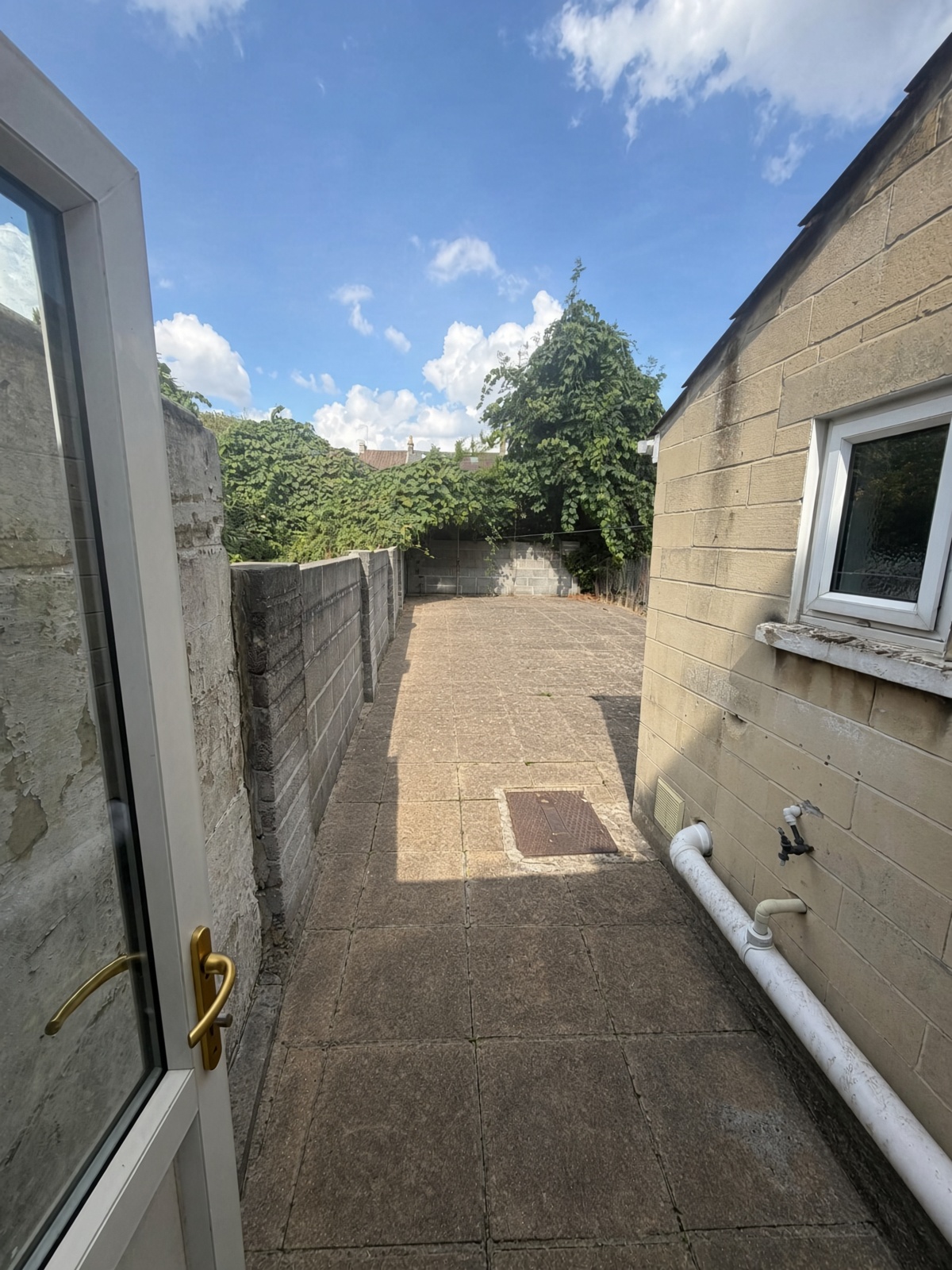 Rear paved patio seen from the back door