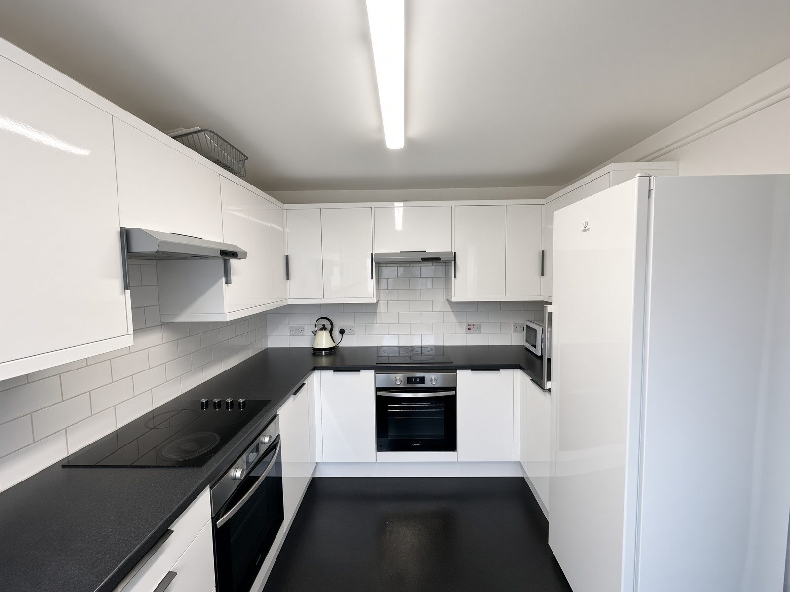 U-shaped kitchen with two hobs and two ovens