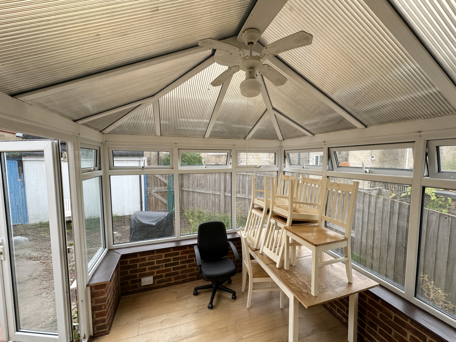 Conservatory with a polycarbonate roof and a dining table