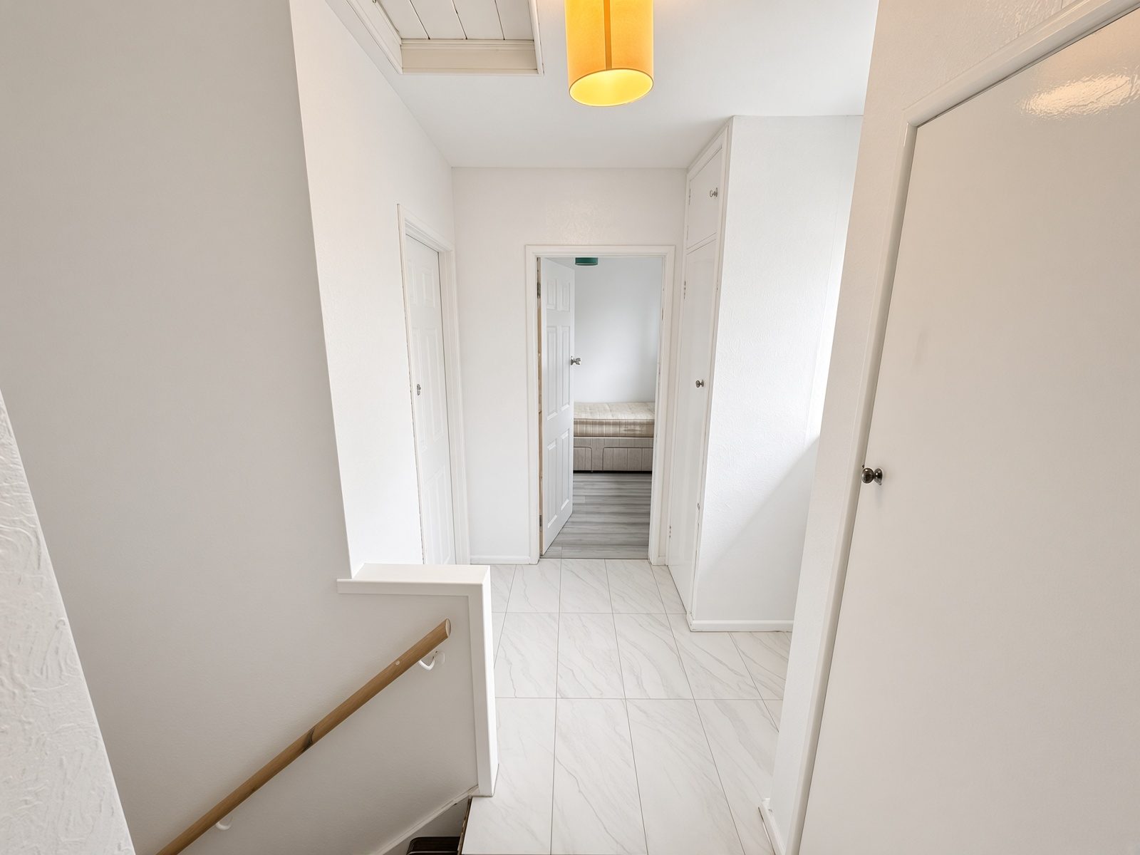 Upper landing looking toward a bedroom doorway