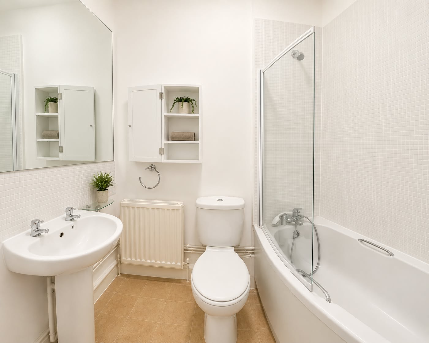 Bathroom with a bath, shower screen, basin, and toilet